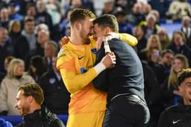 Head coach John Mousinho, right, with Blues keeper Will Norris after Pompey secured the League One title after their 3-2 win against Barnsley on Tuesday night. Picture: Jason Brown/ProSportsImages