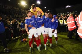 From left: Joe Rafferty, Kusini Yengi, Will Norris, Callum Lang and Christian Saydee celebrate Pompey's League One title win