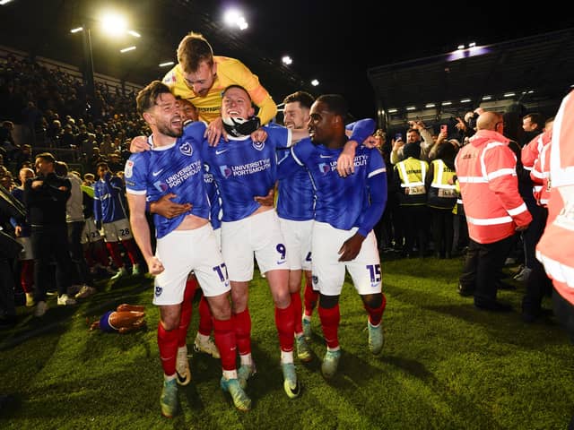 From left: Joe Rafferty, Kusini Yengi, Will Norris, Callum Lang and Christian Saydee celebrate Pompey's League One title win. (Image: CameraSport)