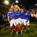 From left: Joe Rafferty, Kusini Yengi, Will Norris, Callum Lang and Christian Saydee celebrate Pompey's League One title win. (Image: CameraSport)