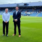 Funding has been secured for a feasibility study to build a bridge from Fratton railway station to The Pompey Centre. Safety concerns had previously been raised, with CEO Andrew Cullen saying a bridge is necessary to expand the North Stand.  Pictured L to R: Portsmouth CEO Andrew Cullen and Portsmouth South MP Stephen Morgan.