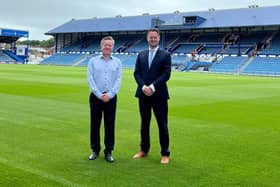 Funding has been secured for a feasibility study to build a bridge from Fratton railway station to The Pompey Centre. Safety concerns had previously been raised, with CEO Andrew Cullen saying a bridge is necessary to expand the North Stand.  Pictured L to R: Portsmouth CEO Andrew Cullen and Portsmouth South MP Stephen Morgan.