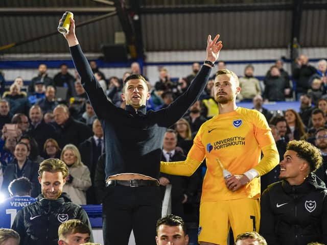 Pompey boss John Mousinho, left, alongside goalkeeper Will Norris after Pompey's victory against Barnsley on Tuesday night