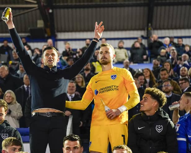 Pompey boss John Mousinho, left, alongside goalkeeper Will Norris after Pompey's victory against Barnsley on Tuesday night