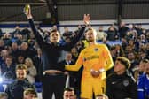 Pompey boss John Mousinho, left, alongside goalkeeper Will Norris after Pompey's victory against Barnsley on Tuesday night