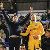 Pompey boss John Mousinho, left, alongside goalkeeper Will Norris after Pompey's victory against Barnsley on Tuesday night