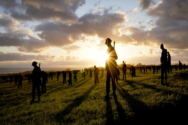 A view of the Standing with Giants silhouettes which create the For Your Tomorrow installation at the British Normandy Memorial, in Ver-Sur-Mer, France, as part of the  80th anniversary of D-Day. The 1,475 statues honour each of the servicemen who fell on D-Day itself and stand in the shadows of the memorial overlooking Gold Beach, where many of them landed almost 80 years ago. Picture: Gareth Fuller/PA Wire