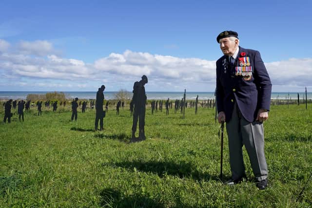 D-Day veteran Mervyn Kersh stands amongst the Standing with Giants silhouettes at the For Your Tomorrow installation at the British Normandy Memorial, in Ver-Sur-Mer, France, as part of the 80th anniversary of D-Day. Picture: Gareth Fuller/PA Wire