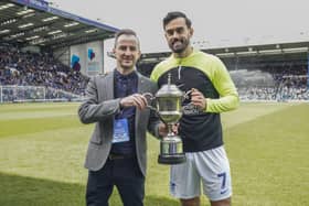 Marlon Pack, right, is presented with The News' Pompey Player of the Season award by Jordan Cross ahead of today's game against Wigan at Fratton Park