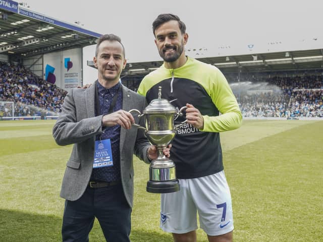 Marlon Pack, right, is presented with The News' Pompey Player of the Season award by Jordan Cross ahead of today's game against Wigan at Fratton Park