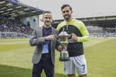 Marlon Pack, right, is presented with The News' Pompey Player of the Season award by Jordan Cross ahead of today's game against Wigan at Fratton Park