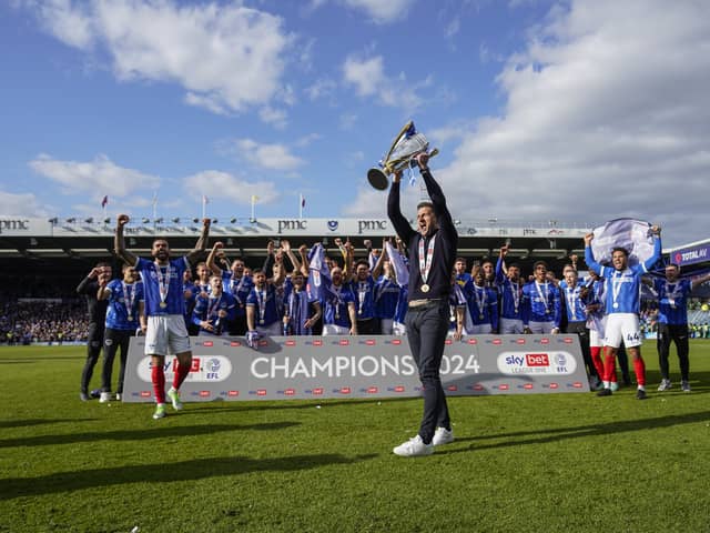 Pompey boss John Mousinho lifts the League One trophy at Fratton Park today. Pic: Jason Brown/ProSportsImages