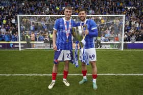 Owen Moxon and Callum Lang savour the League One title. Picture: Jason Brown/ProSportsImages
