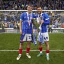 Owen Moxon and Callum Lang savour the League One title. Picture: Jason Brown/ProSportsImages