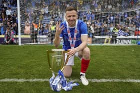 Lee Evans celebrates his fourth promotion to the Championship