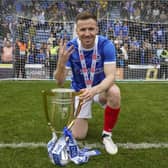 Lee Evans celebrates his fourth promotion to the Championship