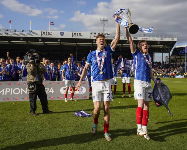 Pompey favourite Sean Raggett lifts the League One trophy with Jack Sparkes. Pic: Jason Brown.