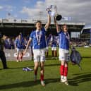 Pompey favourite Sean Raggett lifts the League One trophy with Jack Sparkes. Pic: Jason Brown.