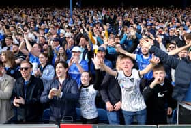 Pompey fans celebrate their title win against Wigan - with the visitors lauded for the class they showed at Fratton Park. Pic: Chris Moorhouse