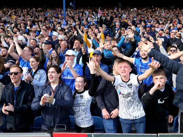 Pompey fans celebrate their title win against Wigan - with the visitors lauded for the class they showed at Fratton Park. Pic: Chris Moorhouse