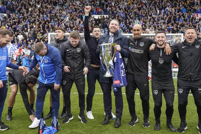 Pompey boss John Mousinho and sporting director Rich Hughes, centre, with the League One Championship trophy