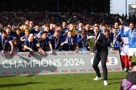 John Mousinho and his Pompey title winners Picture: Peter Nicholls/Getty Images