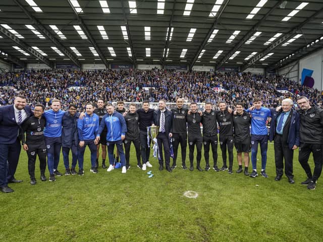 John Mousinho and sporting director Rich Hughes with the backroom staff behind Pompey's success this season. Picture: Jason Brown/ProSportsImages