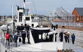The Last Post is played during an Anzac Day service of remembrance on board HMS M.33, the sole-surviving ship from the Gallipoli campaign