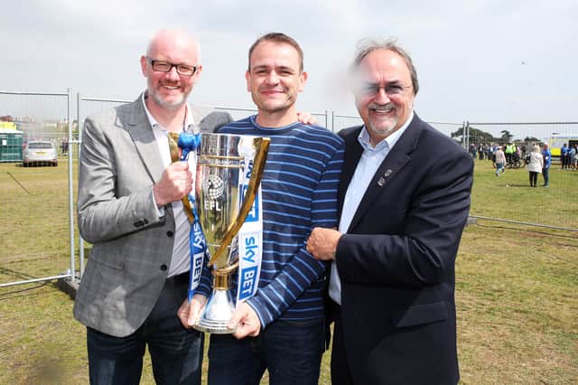 Pompey Trust and football club board members Ashley Brown, John Kimbell and Mark Trapani at the League Two title celebrations in May 2017. Picture: Joe Pepler