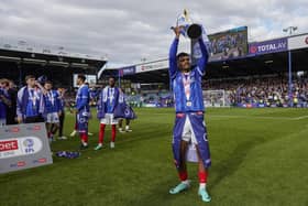 Chelsea loanee Tino Anjorin celebrates Pompey's League One title win. Pic: Jason Brown.