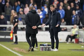 Pompey head coach John Mousinho tries to reason with the fourth official during todays game at Lincoln after referee Sunny Sukhvir Gill dished out 10 yellows to Pompey players and staff