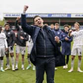 John Mousinho celebrates a 2-0 victory at Lincoln which brought the curtain down on their season. Picture: Jason Brown/ProSportsImages