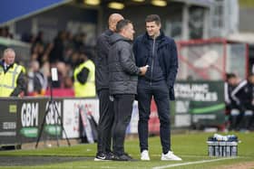 Pompey head coach John Mousinho, right, with Jon Harley and Zesh Rehman