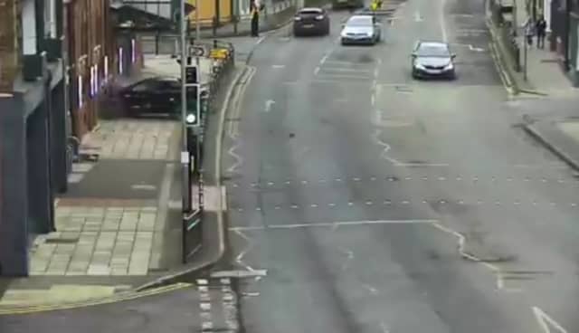 Car crashes through metal barriers and into the front of theatre.