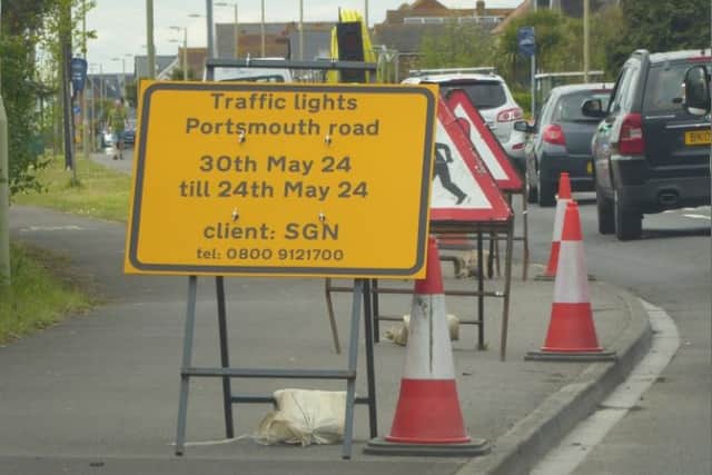 The sign on Portsmouth Road warns drivers of temporary traffic lights on the road from “30 May 2024 till 24 May 2024”. Pic: John Oram/Facebook