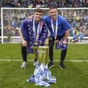 Pompey defender Zak Swanson's Fratton future is in the balance, after his contract option wasn't taken up. Here he is with Tom Lowery after the Wigan title win. Pic: Jason Brown/ProSportsImages
