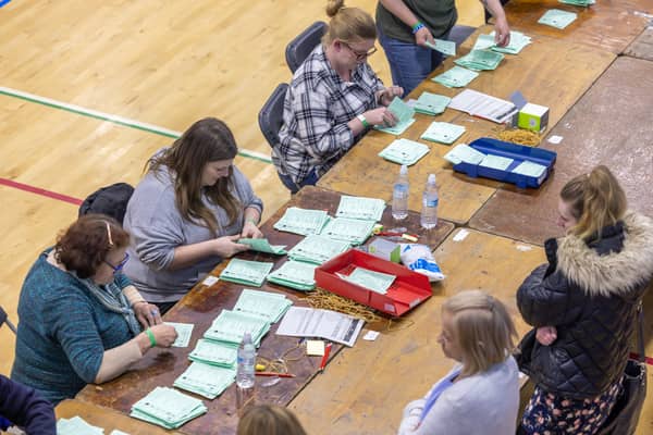 Counting ballot papers at Gosport Leisure Centre. Picture: Mike Cooter (030524)