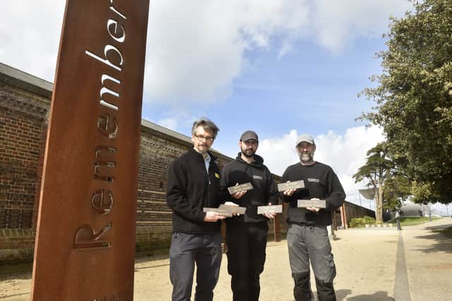 57 named bricks were added to the Normandy Memorial Wall at the D Day Story in Southsea, on Monday, April 29.  Pictured is: Andrew Whitmarsh, curator at the D Day Story with Tommy Fletcher and Bill Sharpe from Stonerite Memorials in Hilsea. Picture: Sarah Standing (290424-1169)