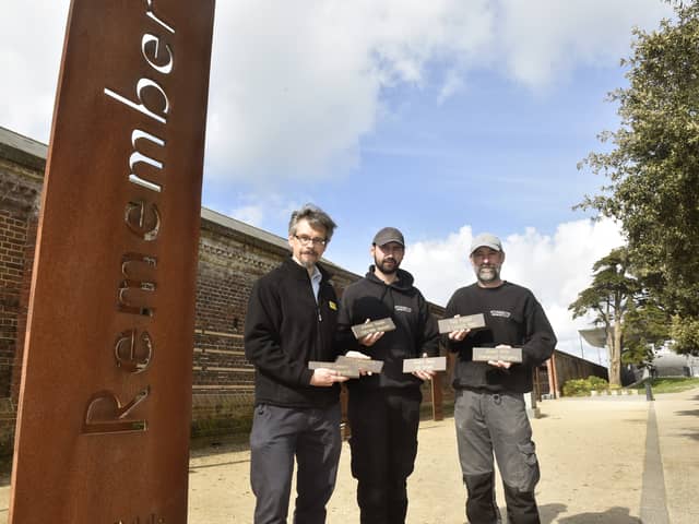 57 named bricks were added to the Normandy Memorial Wall at the D Day Story in Southsea, on Monday, April 29.  Pictured is: Andrew Whitmarsh, curator at the D Day Story with Tommy Fletcher and Bill Sharpe from Stonerite Memorials in Hilsea. Picture: Sarah Standing (290424-1169)
