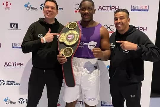 Heart of Portsmouth's Derrick Osalodor, here with his coaching team, has won the England Boxing National Amateur Championships super-heavyweight title.
