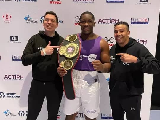 Heart of Portsmouth's Derrick Osalodor, here with his coaching team, has won the England Boxing National Amateur Championships super-heavyweight title.
