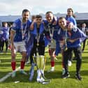 Joe Rafferty, left, with Zak Swanson, Colby Bishop and Tom Lowery after Pompey lifted the League One championship trophy