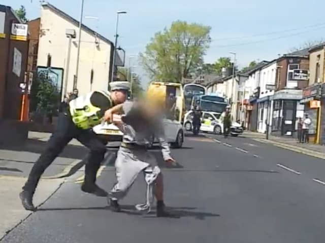 Police officer tackles suspected bike thief to ground.