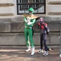 Hundreds of people have turned out this morning to get a glimpse of the action at Comic Con. 
Pictured: Sam Thomas with his nephew Leo. 