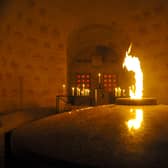 The "Eternal Flame" at the Douaumont boneyard (Ossuaire de Douaumont) on November 10, 2015, in Douaumont, eastern France, on the eve of the Armistice Day. The flame is being brought to Portsmouth as part of a journey to the USA for the 80th anniversary of D-Day. Picture: JEAN-CHRISTOPHE VERHAEGEN/AFP via Getty Images.