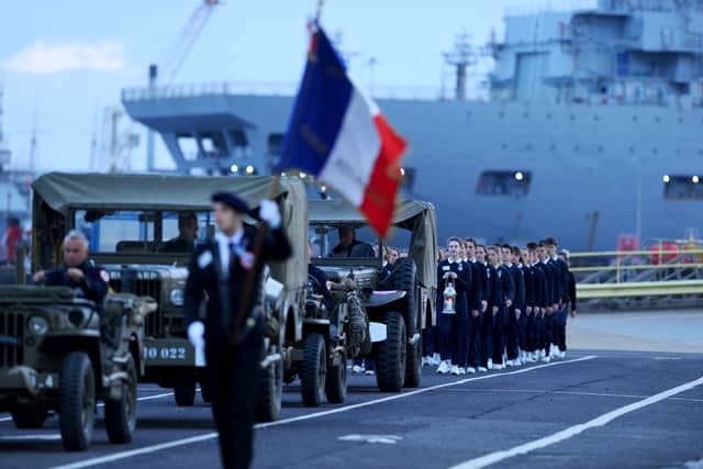 The Flame of the French Nation being brought to Portsmouth International Port during a small procession on May 14. Picture: Sarah Standing (140524-8861)