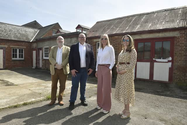 Carpenter's Yard in Priddy's Hard is going to be transformed into an artists quarter for Gosport residents. Pictured is: (l-r) Phil Gibby, South West director for Arts Council England, Darren Henley, chief executive of Arts Council England, Gosport MP Dame Caroline Dinenage and Hannah Prowse, chief executive at Portsmouth Historic Quarter. Picture: Sarah Standing (100524-2246)