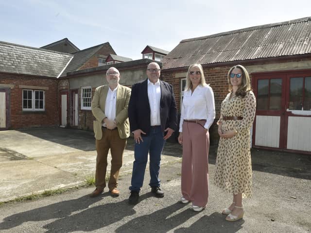 Carpenter's Yard in Priddy's Hard is going to be transformed into an artists quarter for Gosport residents. Pictured is: (l-r) Phil Gibby, South West director for Arts Council England, Darren Henley, chief executive of Arts Council England, Gosport MP Dame Caroline Dinenage and Hannah Prowse, chief executive at Portsmouth Historic Quarter. Picture: Sarah Standing (100524-2246)