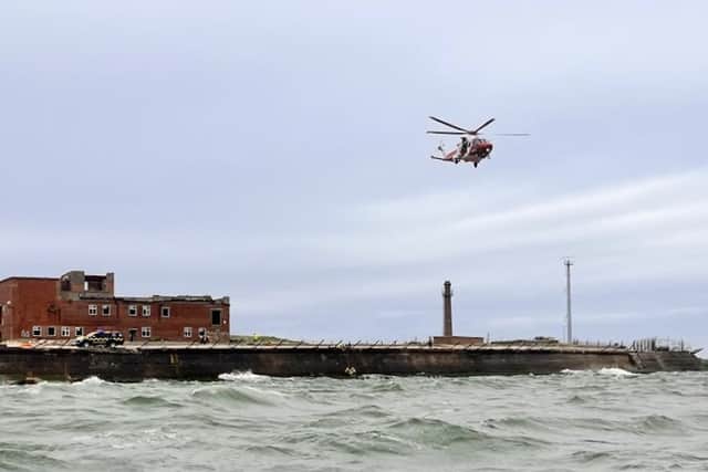 RNLI volunteers have rescued a 22-year-old who  found herself injured and in the water near Langstone.
Due to 'challenging' conditons, she had to airlifted out of the water. 
Picture: RNLI/ Luke Kierman