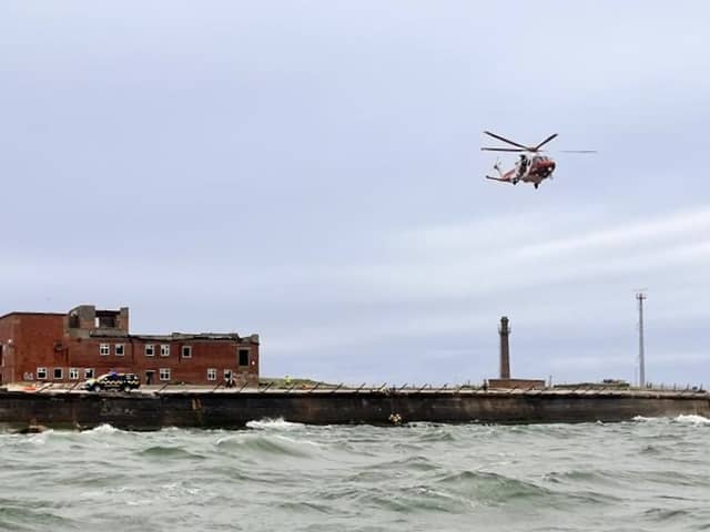 RNLI volunteers have rescued a 22-year-old who  found herself injured and in the water near Fraser Range.
Due to 'challenging' conditons, she had to airlifted out of the water. 
Picture: RNLI/ Luke Kierman